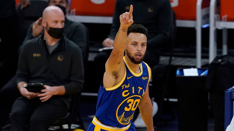 Golden State Warriors guard Stephen Curry celebrates after scoring against the Orlando Magic