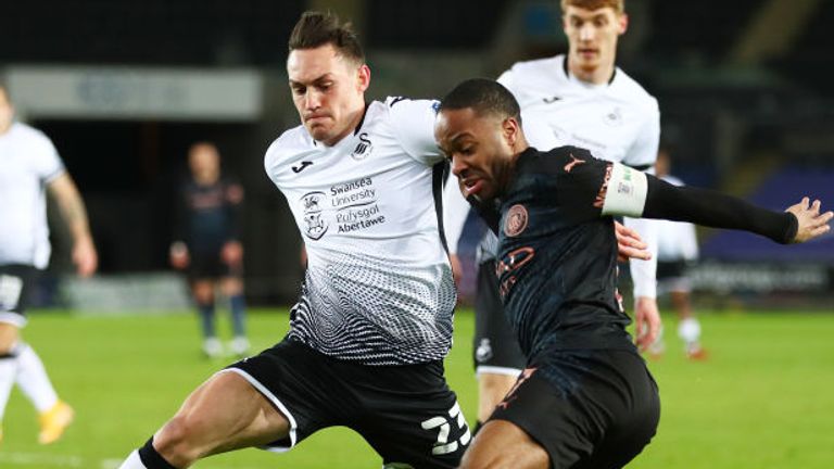 Raheem Sterling holds off Connor Roberts