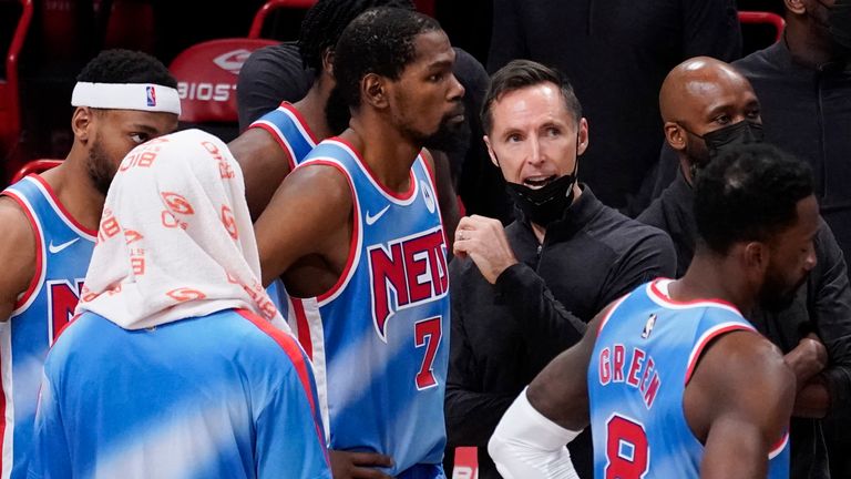 Brooklyn Nets head coach Steve Nash, right, gives his team instruction during a time out