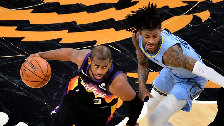 Phoenix Suns guard Chris Paul drives against Memphis Grizzlies guard Ja Morant