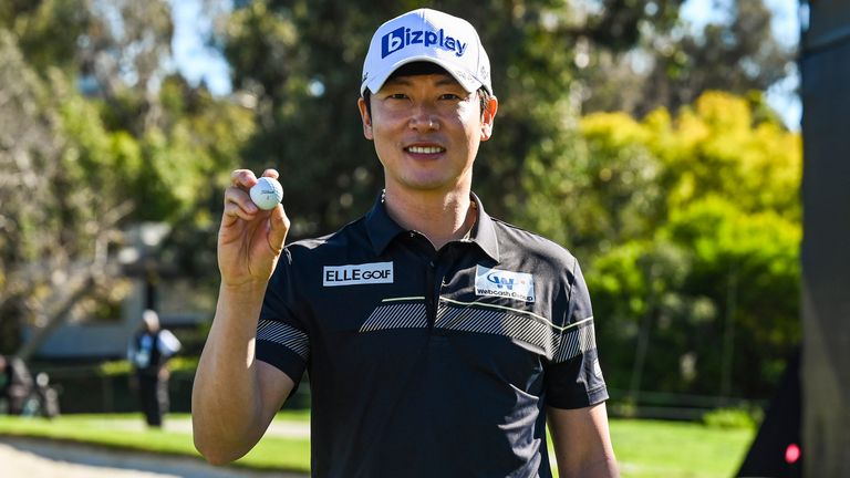 Tae Hoon Kim of South Korea smiles and poses with his ball after making a hole-in-one (ace) on the 16th hole during the first round of The Genesis Invitational at Riviera Country Club on February 18, 2021 in Pacific Palisades, California. (Photo by Keyur Khamar/PGA TOUR via Getty Images)