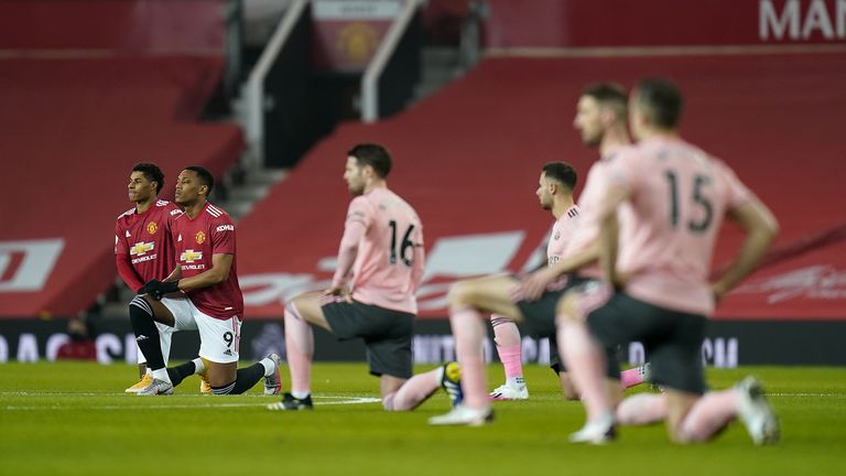 Manchester United&#39;s Marcus Rashford (left) and Anthony Martial take a knee in support of the Black Lives Matter Movement before the Premier League match at Old Trafford, Manchester. Picture date: Wednesday January 27, 2021.