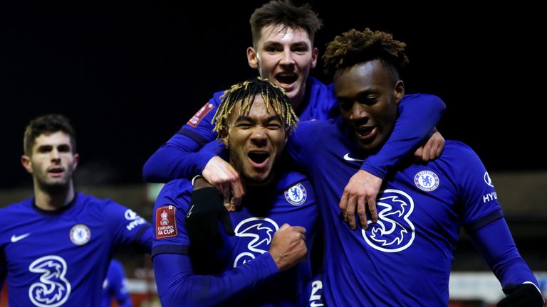 Tammy Abraham celebrates with Reece James and Billy Gilmour after scoring against Barnsley