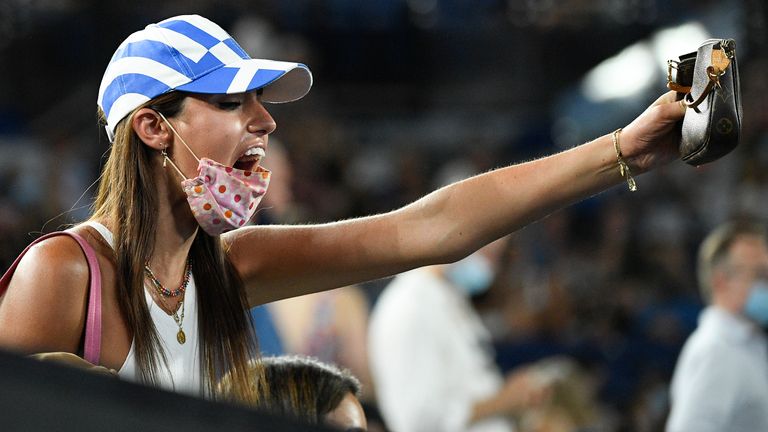 A supporter of Greece's Stefanos Tsitsipas gestures during his semifinal against Russia's Daniil Medvedev during their semifinal match at the Australian Open tennis championship in Melbourne, Australia, Friday, Feb. 19, 2021.(AP Photo/Andy Brownbill)