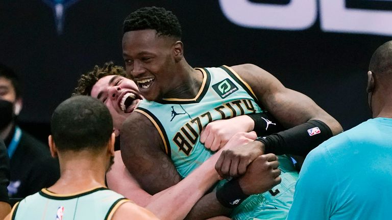 Charlotte Hornets guard Terry Rozier celebrates after scoring the game winning basket with LaMelo Ball, against the Golden State Warriors