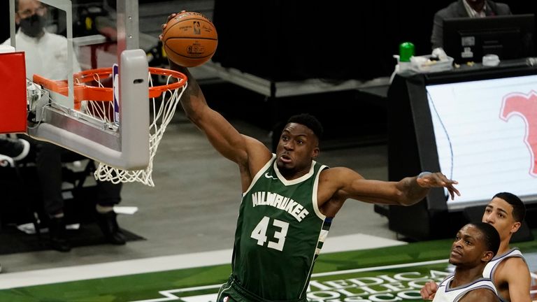 Milwaukee Bucks&#39; Thanasis Antetokounmpo dunks during the second half of an NBA basketball game against the Sacramento Kings