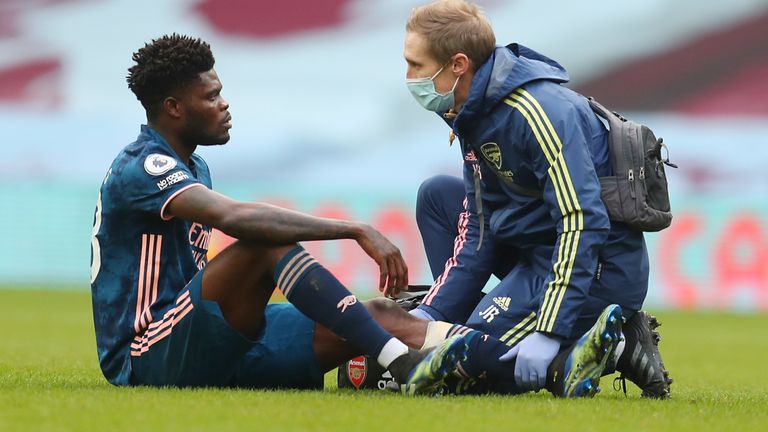 Thomas Partey needs treatment during Arsenal's defeat at Aston Villa