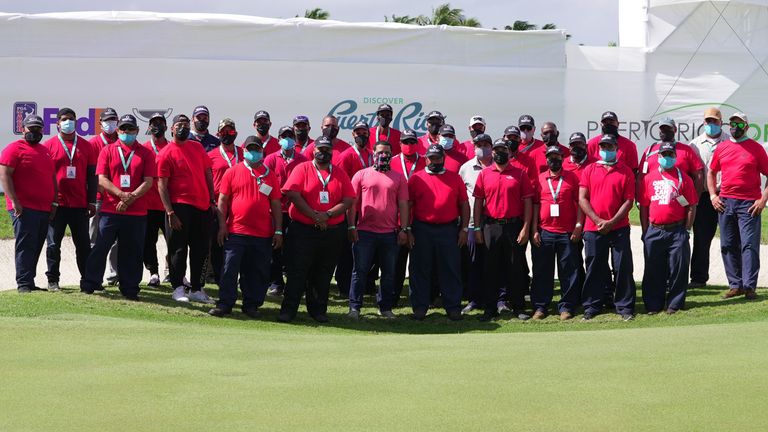 The maintenance crew in Puerto Rico all in red and black as a tribute to Tiger Woods