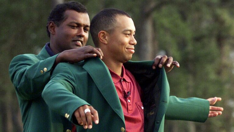 Tiger Woods receiving his Masters green jacket from champion Vijay Singh, of Fiji, after winning the 2001 Masters at the Augusta National Golf Club in Augusta, Ga.