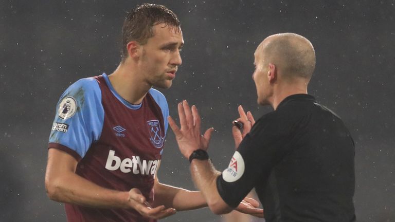 Tomas Soucek protests to Mike Dean after being sent off against Fulham