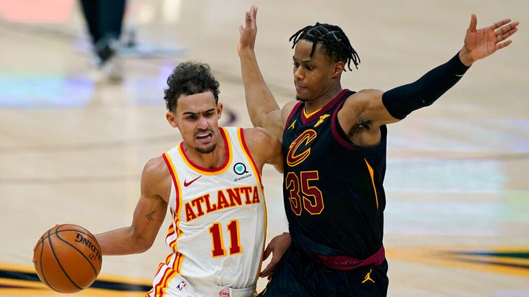 AP - Atlanta Hawks&#39; Trae Young (11) drives to the basket against Cleveland Cavaliers&#39; Isaac Okoro