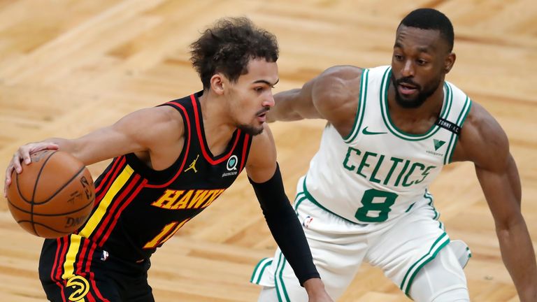 Atlanta Hawks&#39; Trae Young drives past Boston Celtics&#39; Kemba Walker