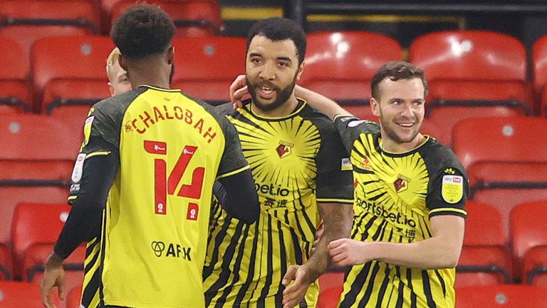 Troy Deeney is congratulated after scoring from the penalty spot to put Watford 1-0 up against QPR