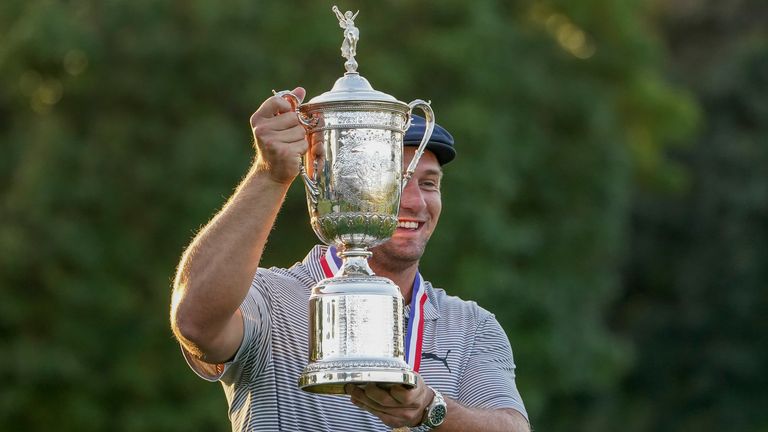 Bryson DeChambeau, of the United States, holds up the winner's trophy after winning US Open Golf Championship,