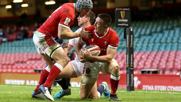 Wales&#39; Josh Adams celebrates scoring his sides first try during the Guinness Six Nations match at the Principality Stadium, Cardiff. Picture date: Saturday February 27, 2021