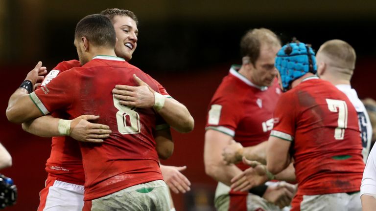 Wales&#39; Rhodri Jones and Taulupe Faletau (back to camera) celebrate after the Guinness Six Nations match at the Principality Stadium, Cardiff. Picture date: Saturday February 27, 2021. See PA story RUGBYU Wales. Photo credit should read: David Davies/PA Wire. RESTRICTIONS: Use subject to restrictions. Editorial use only, no commercial use without prior consent from rights holder.