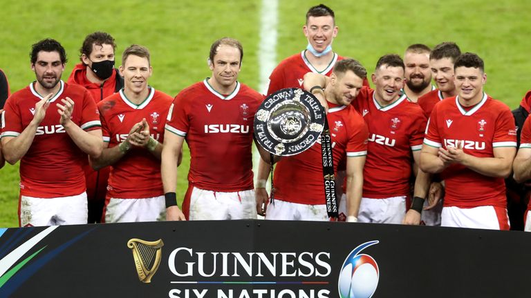 Wales celebrate winning the triple crown after the Guinness Six Nations match at the Principality Stadium, Cardiff. Picture date: Saturday February 27, 2021. See PA story RUGBYU Wales. Photo credit should read: David Davies/PA Wire. RESTRICTIONS: Use subject to restrictions. Editorial use only, no commercial use without prior consent from rights holder.