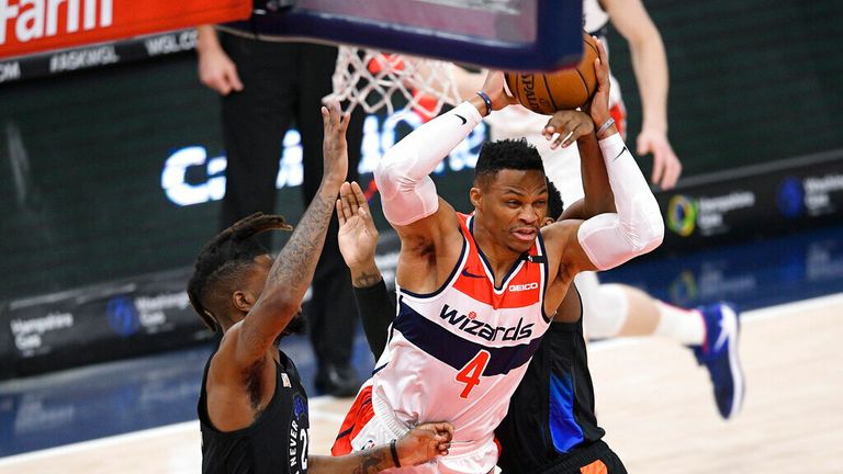 AP - Washington Wizards guard Russell Westbrook (4) tries to get past New York Knicks forward Reggie Bullock, left, and guard RJ Barrett