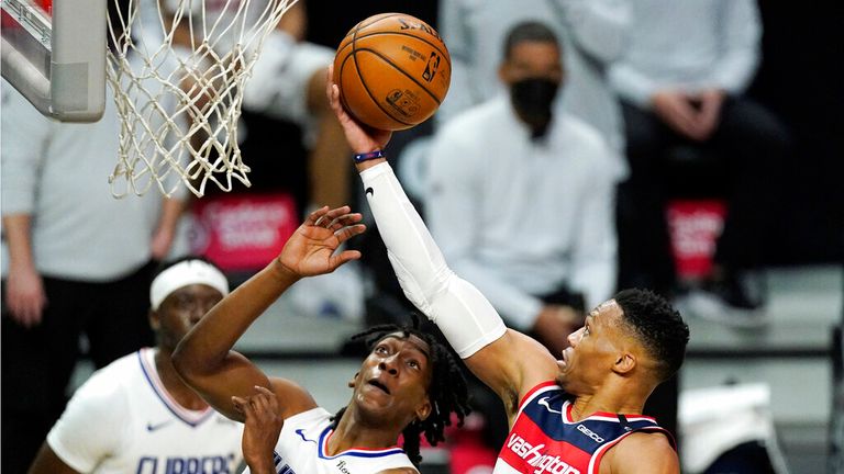 AP - Washington Wizards guard Russell Westbrook, right, shoots as Los Angeles Clippers guard Terance Mann