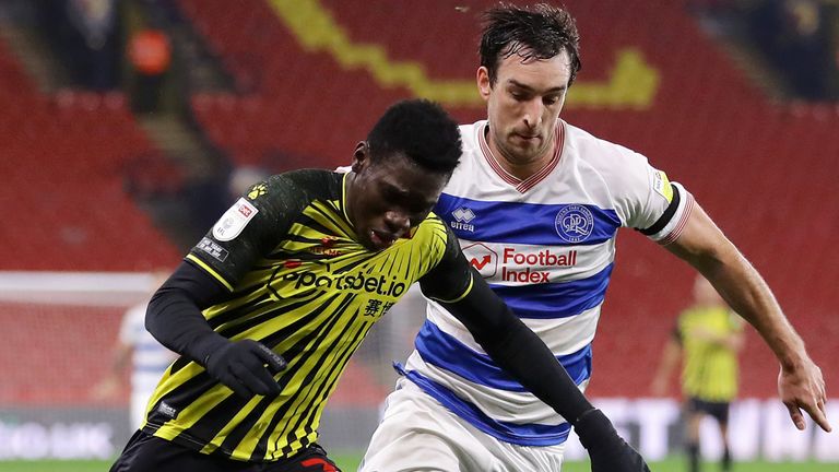 Ismaila Sarr controls the ball under pressure from Lee Wallace