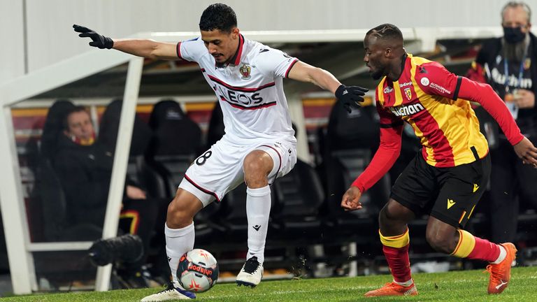 William Saliba of OGC Nice competes for the ball with Ignatius Ganago of RC Lens 