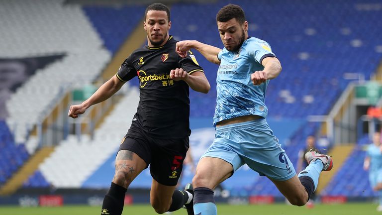 Watford&#39;s William Troost-Ekong (left) and Coventry City&#39;s Maxime Biamou battle for the ball