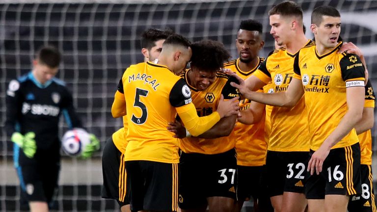 Wolves players celebrate after Adama Traore's shot led to Illan Meslier scoring an own goal