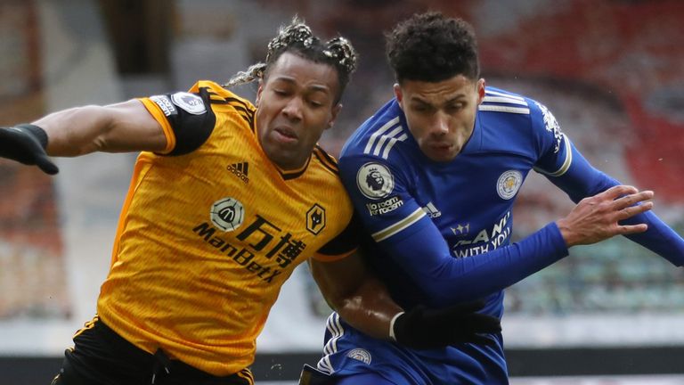 Adama Traore is challenged by James Justin 