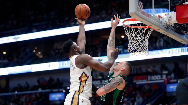 New Orleans Pelicans forward Zion Williamson goes to the basket against Boston Celtics center Daniel Theis