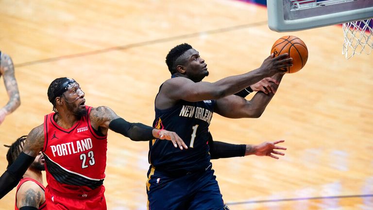 AP - New Orleans Pelicans forward Zion Williamson (1) goes to the basket past Portland Trail Blazers forward Robert Covington