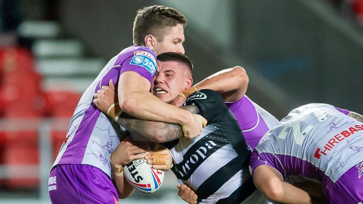 Picture by Allan McKenzie/SWpix.com - 29/10/2020 - Rugby League - Betfred Super League - Hull KR v Hull FC - The Totally Wicked Stadium, Langtree Park, St Helens, England - Hull FC's Joe Cator is tackled by Hull KR's Matt Parcell.