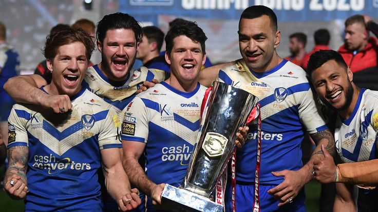 St Helens players celebrate with Super League Grand Final trophy