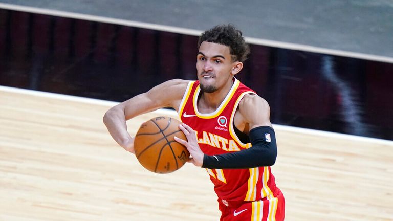 AP - Atlanta Hawks guard Trae Young passes the ball during the second half 