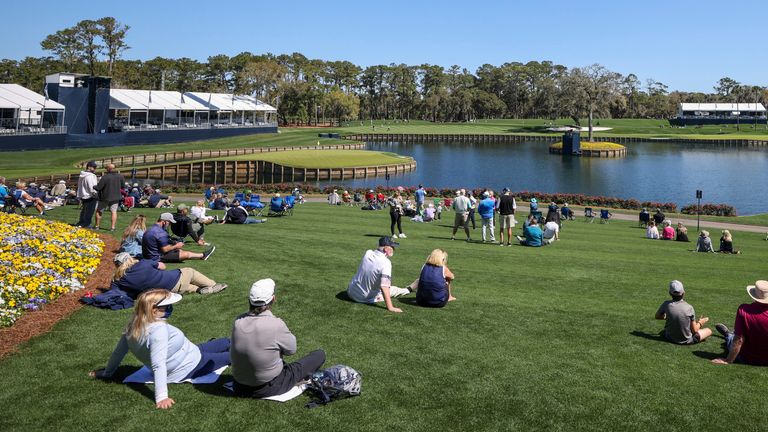 Fans sit around the 17th green during practice rounds for THE PLAYERS Championship on March 9, 2021 at TPC Sawgrass Stadium Course in Ponte Vedra Beach