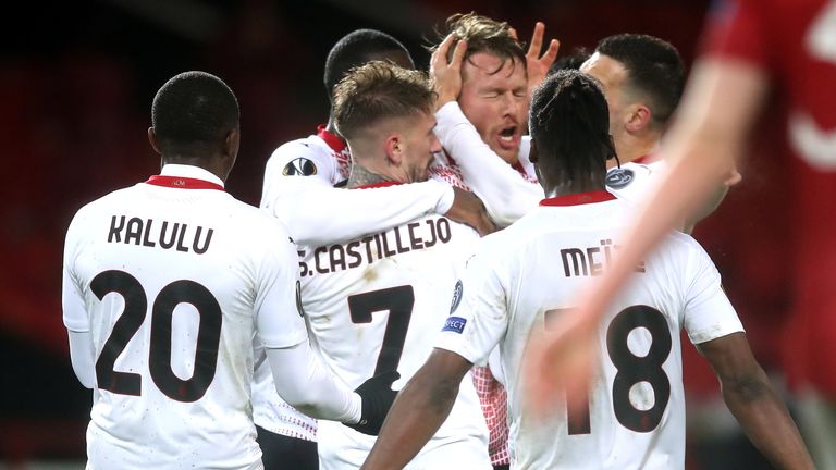 AC Milan players celebrate their late equaliser