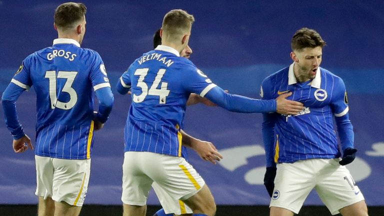 Adam Lallana celebrates after giving Brighton the lead against Leicester