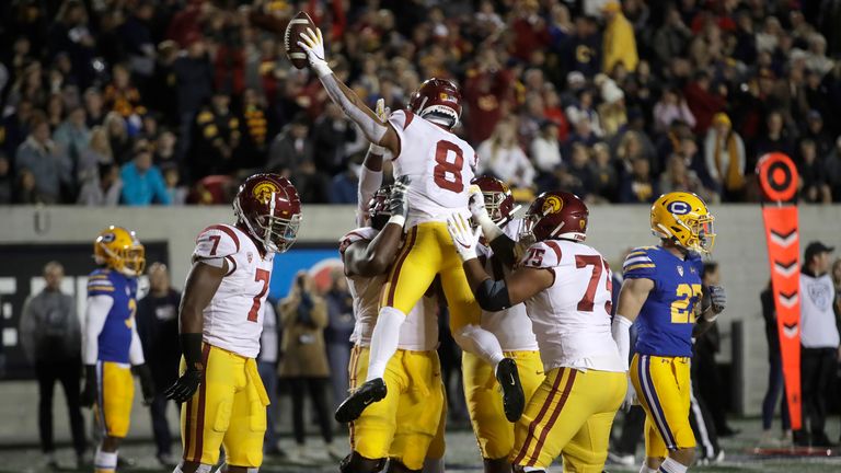 St. Brown celebrates after scoring a touchdown against UCLA in November 2019. (AP Photo/Ben Margot)