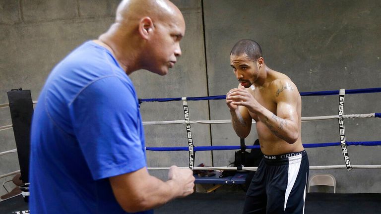 In this June 1, 2015 photo, Andre Ward, right, works out with trainer Virgil Hunter in Hayward, Calif. Super Middleweight champion Andre Ward is ready for his 19-month layoff to come to an end Saturday, June 20, 2015, when he takes on England's Paul Smith in a non-title fight. (AP Photo/Jeff Chiu)