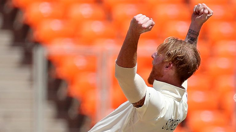 AP Newsroom - Ben Stokes celebrates the wicket of Rohit Sharma