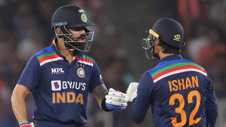 AP Newsroom - India's Ishan Kishan, right, fist bumps India...s captain Virat Kohli after hitting a boundary during the second Twenty20 cricket match between India and England at Narendra Modi Stadium in Ahmedabad, India, Sunday, March 14, 2021. (AP Photo/Aijaz Rahi)