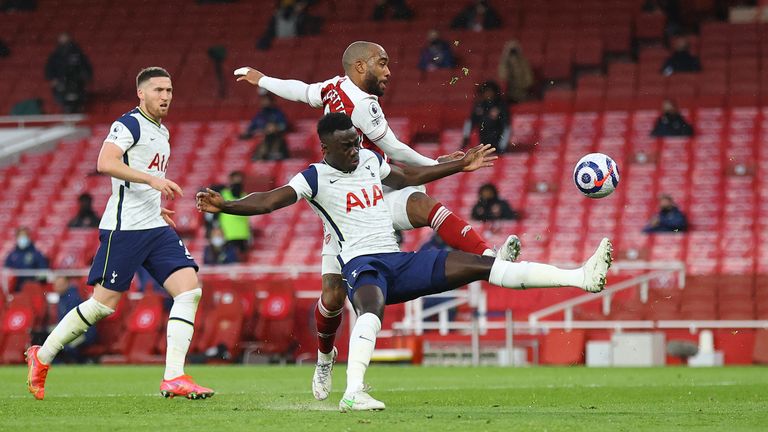 Davinson Sanchez gave away a penalty for this foul on Alexandre Lacazette