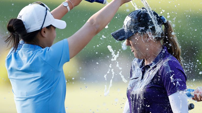 Austin Ernst was sprayed on the 18th green after her five-shot victory 