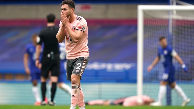 George Baldock reacts after David McGoldrick's gilt-edged miss