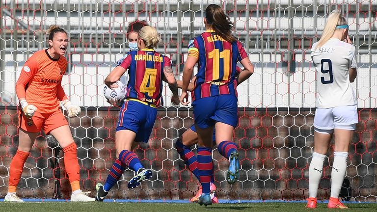 Barcelona goalkeeper Sandra Panos celebrates after saving a penalty shot by Man City's Chloe Kelly