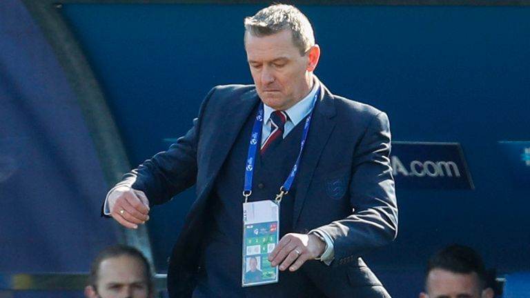 England coach Aidy Boothroyd kicks the ball during the Euro U21 group D soccer match between England and Switzerland in Koper, Slovenia, Thursday, March 25, 2021. (AP Photo/Darko Bandic)