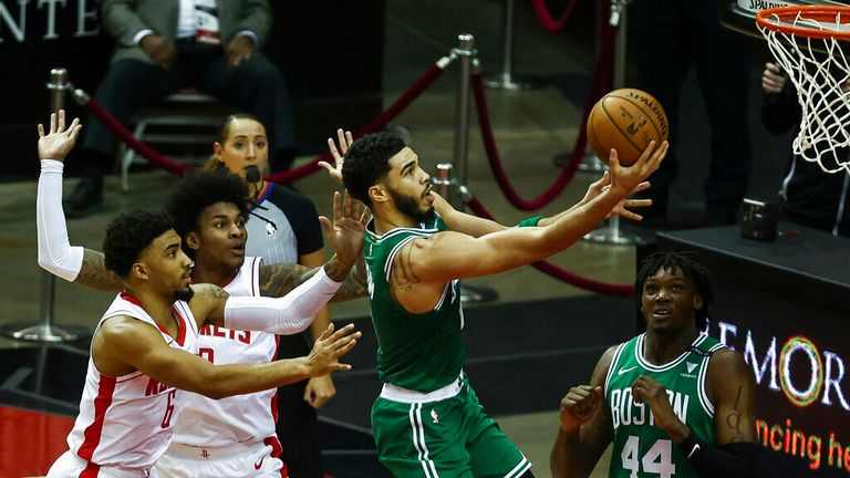 AP - Boston Celtics forward Jayson Tatum (0) scores a basket during the first quarter