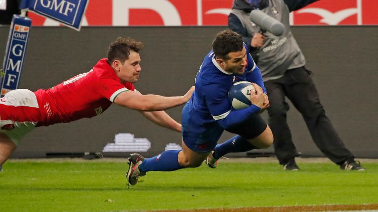 France's Brice Dulin, right, crosses the line to score the winning try during the Six Nations rugby union international between France and Wales at the Stade de France in Saint-Denis, near Paris, Saturday, March 20, 2021. (AP Photo/Francois Mori)