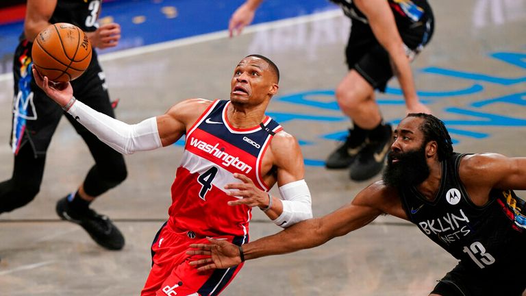 AP - Brooklyn Nets guard James Harden (13) tries to stop Washington Wizards guard Russell Westbrook (4) as Westbrook drives to the basket 