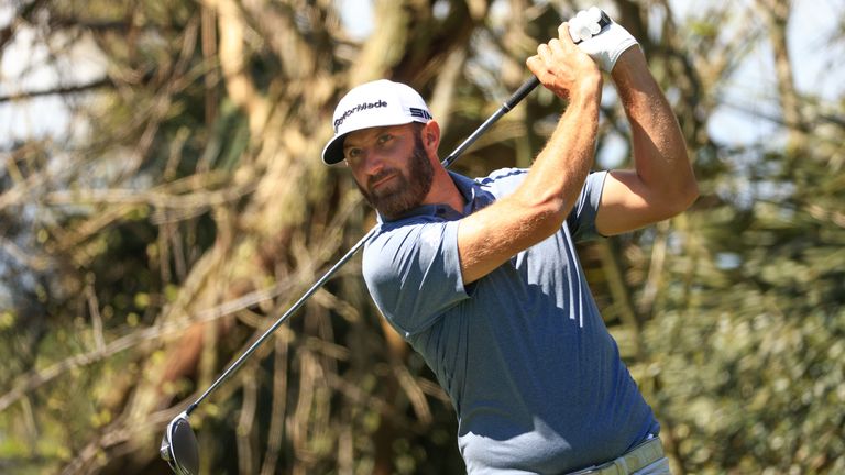  Dustin Johnson of the United States plays his shot from the fifth tee during the second round of THE PLAYERS Championship on THE PLAYERS Stadium Course at TPC Sawgrass on March 12, 2021 in Ponte Vedra Beach, Florida.