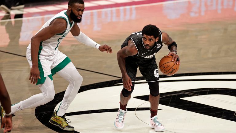 Brooklyn Nets guard Kyrie Irving (11) looks to pass the ball against the Boston Celtics